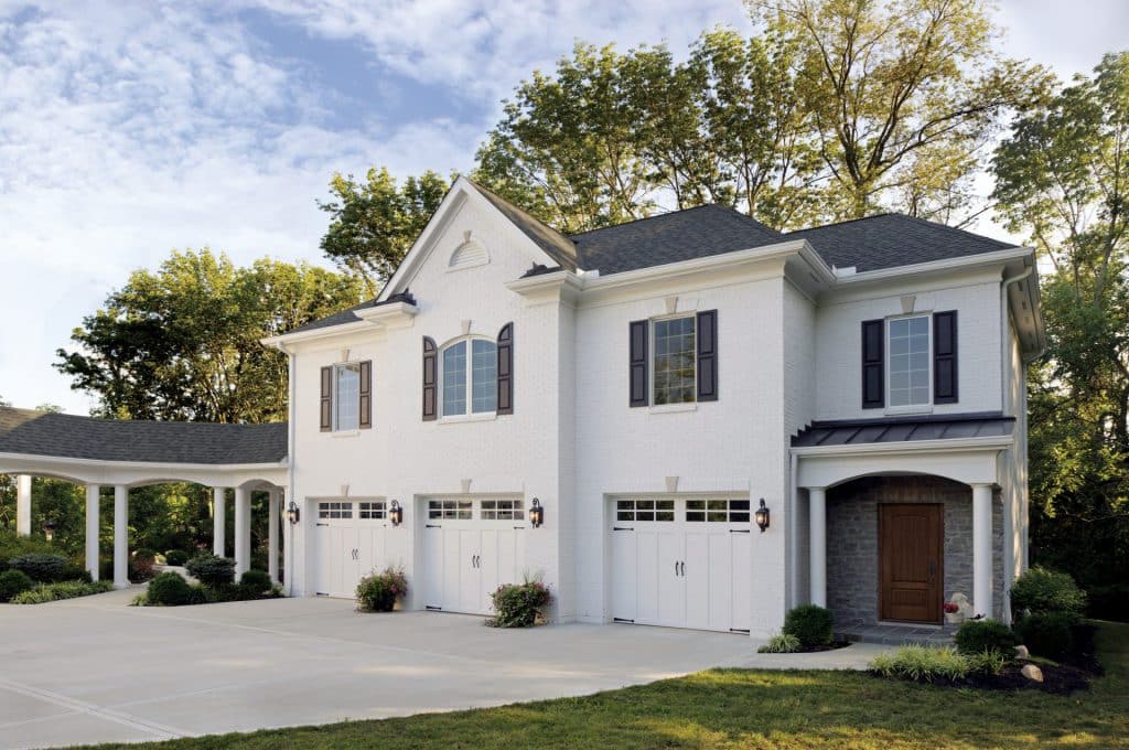 Beautiful house with white garage doors