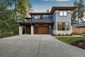 Modern, wood look with slat windows, garage door in a modern looking home | How To Choose A Garage Door