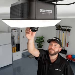 A LiftMaster technician adjusts garage door opener camera