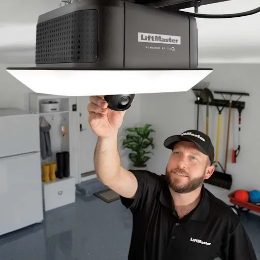 A LiftMaster technician adjusts garage door opener camera
