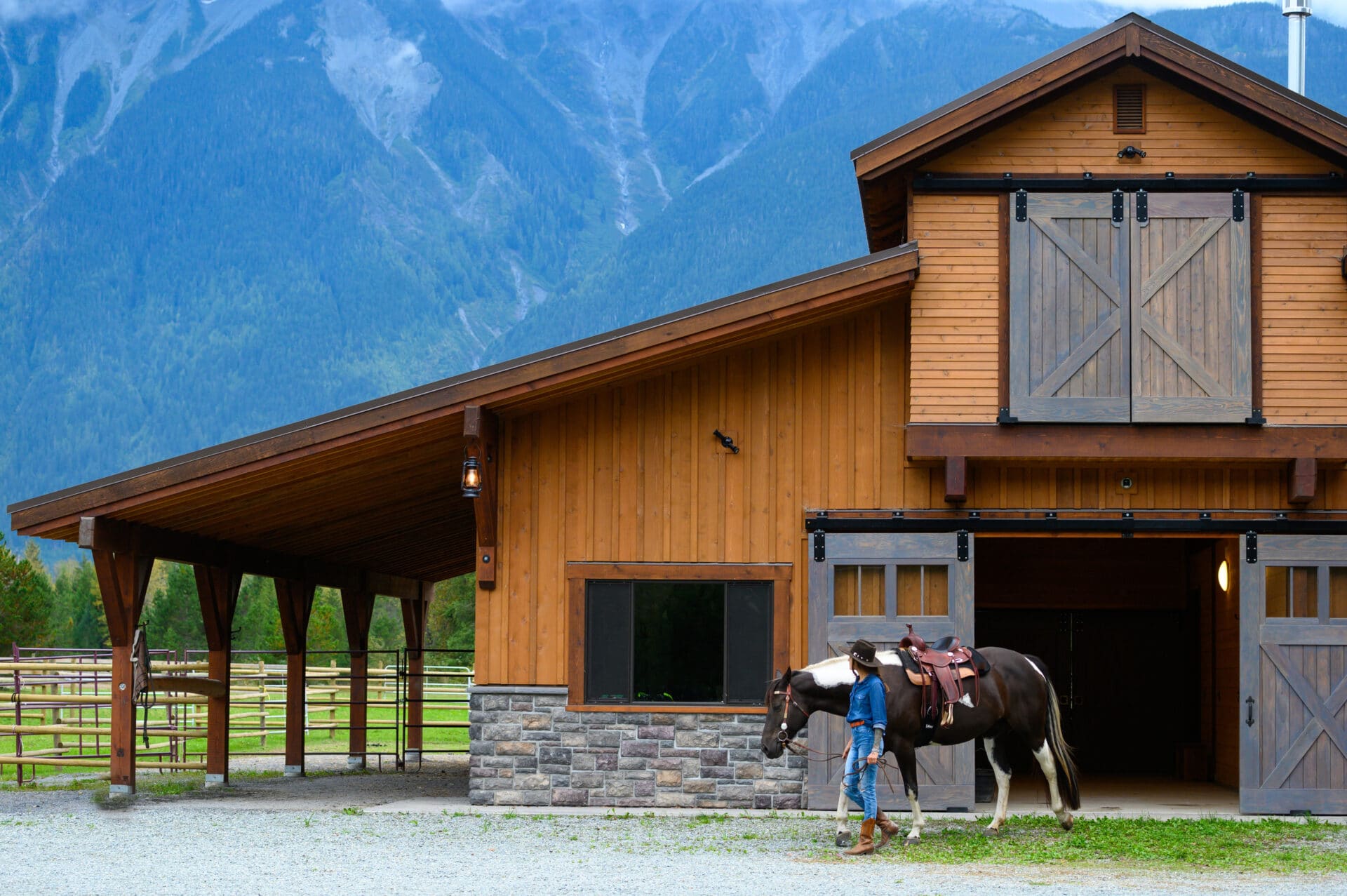 Female farmer working with horses. Rancher working on a Canadian ranch. Empowered woman working in agriculture.