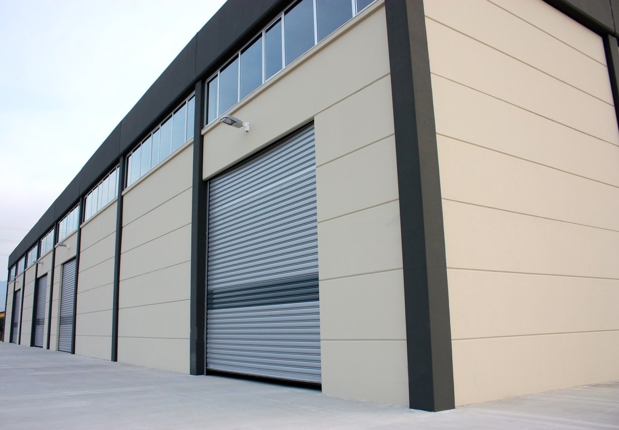 Warehouse building with steel garage doors