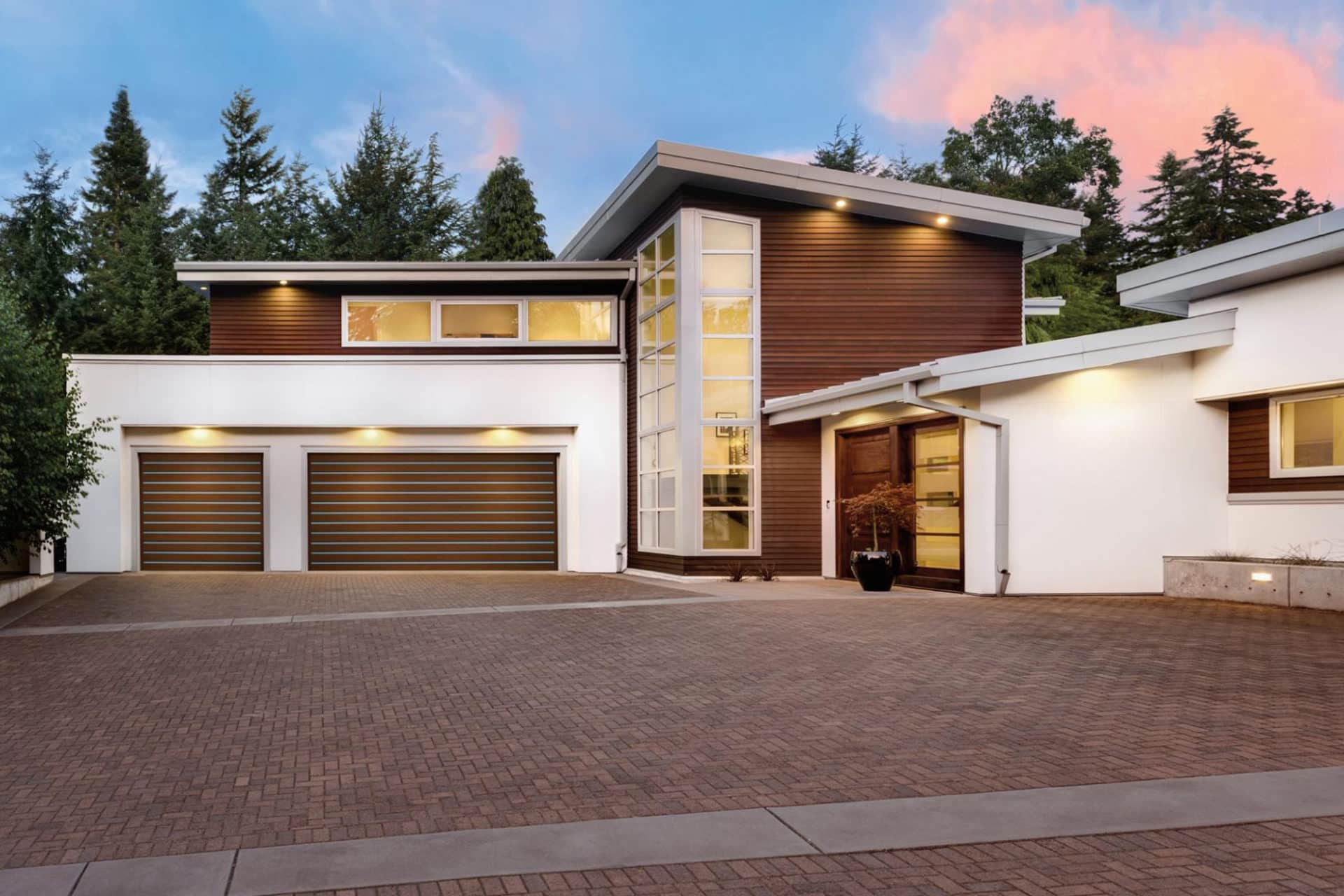 House with large driveway and garage doors
