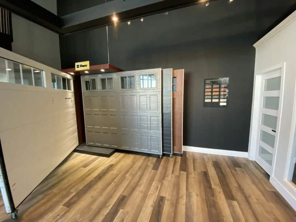 Charcoal coloured garage door on display in a garage door showroom in Barrie Ontario