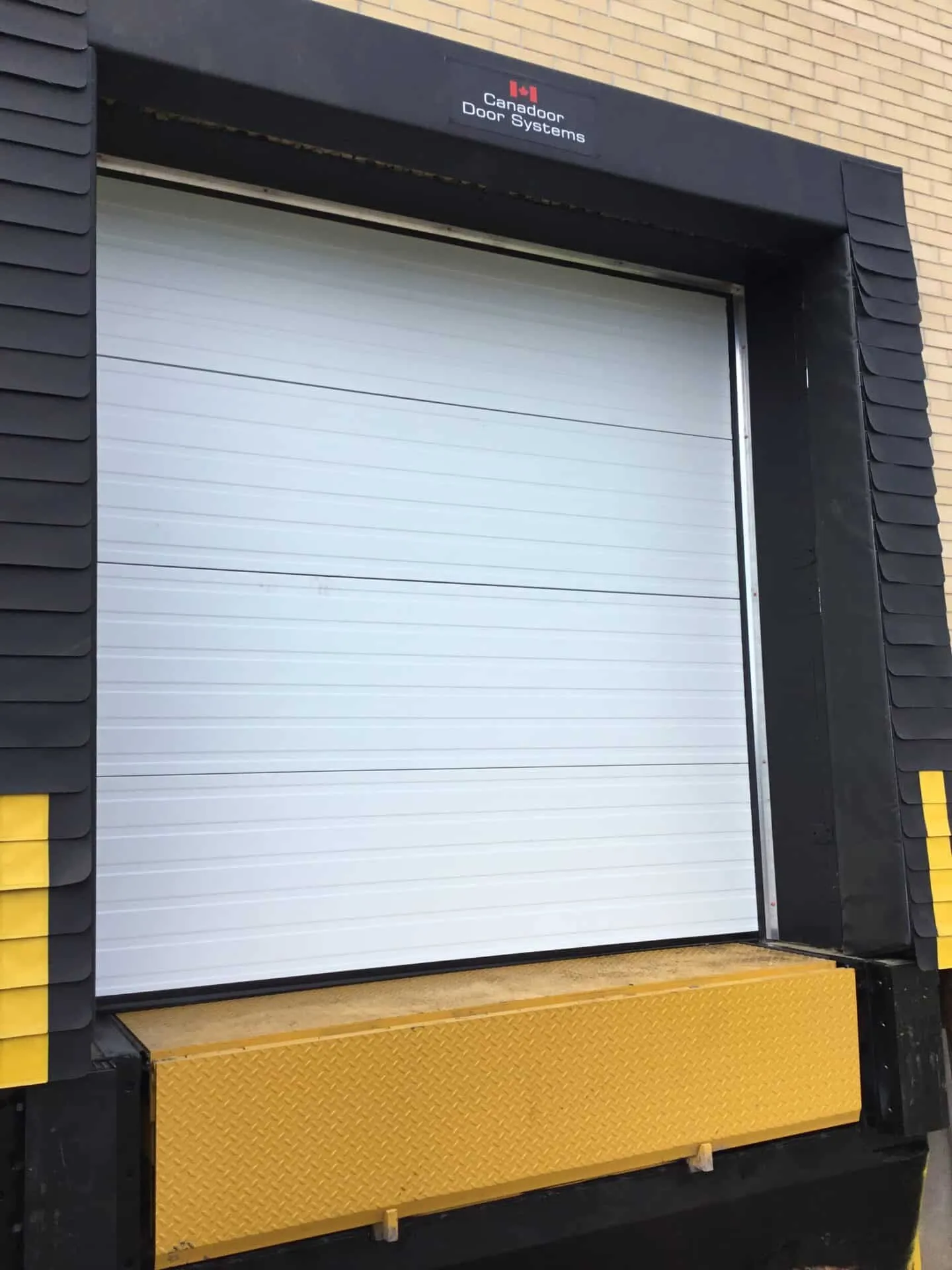 Yellow loading dock and black steel faced dock bumpers