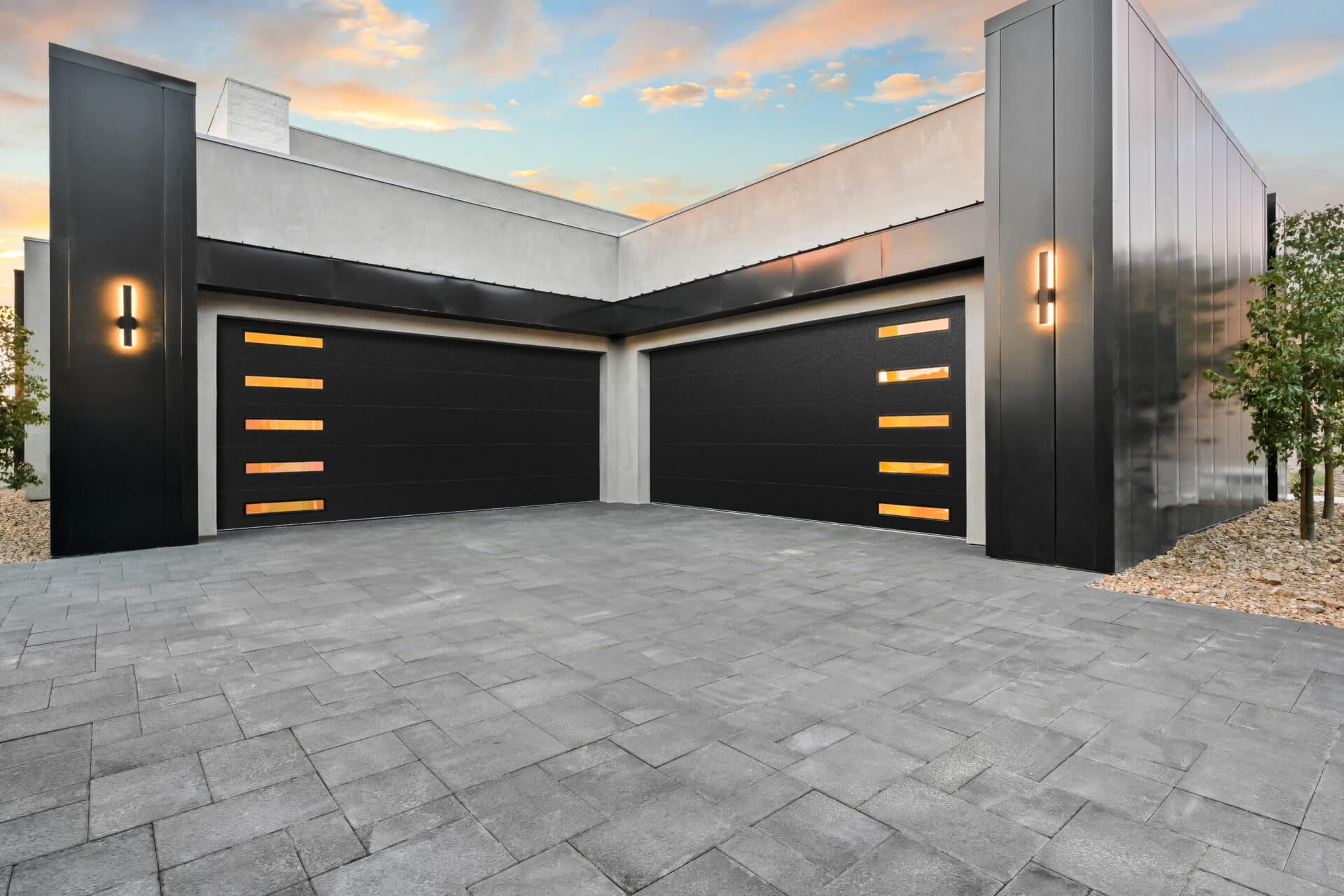 Black garage door with slim windows on modern home