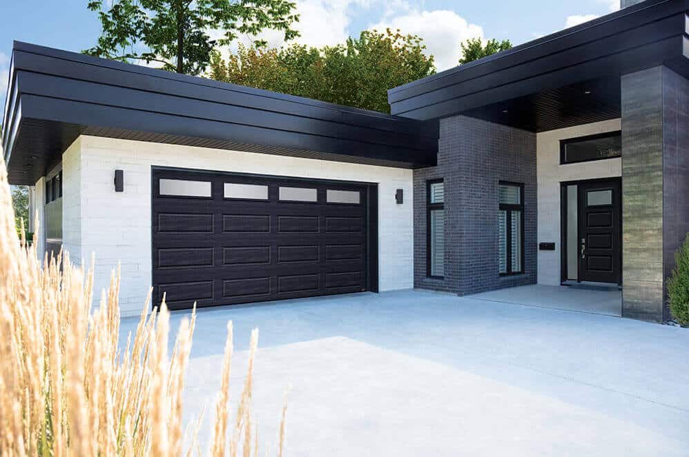 modern black garaga garage door on a modern home in Barrie