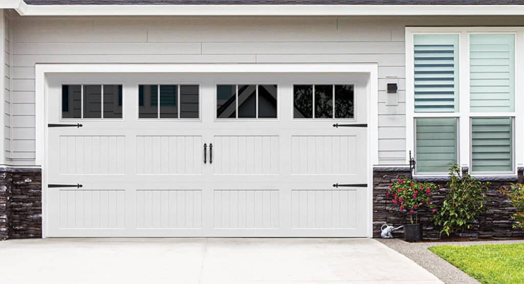 White Wayne Dalton carriage style garage door with decorative handles