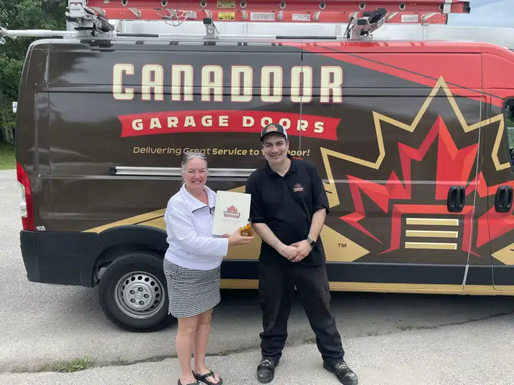 garage door technician with a happy customer in Toronto