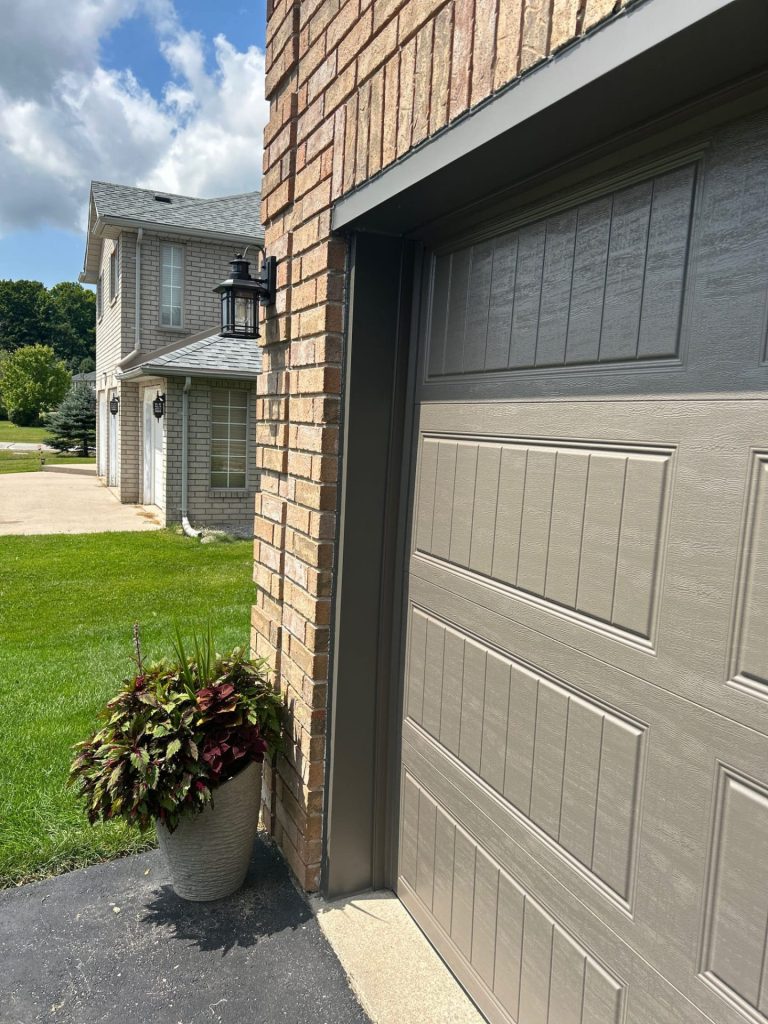 Residential garage door with raised panel design