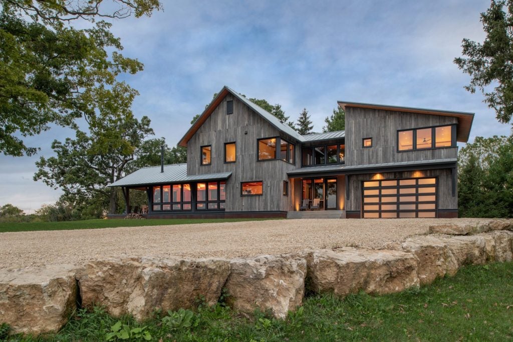 Modern home with a contemporary garage door and large windows