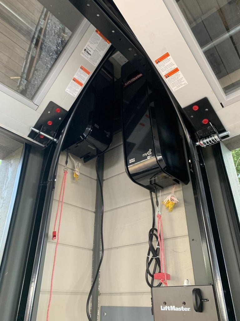LiftMaster garage door openers mounted above a sectional garage door